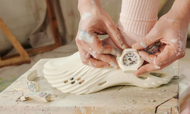 person adjusting g-shock casio watch on croc