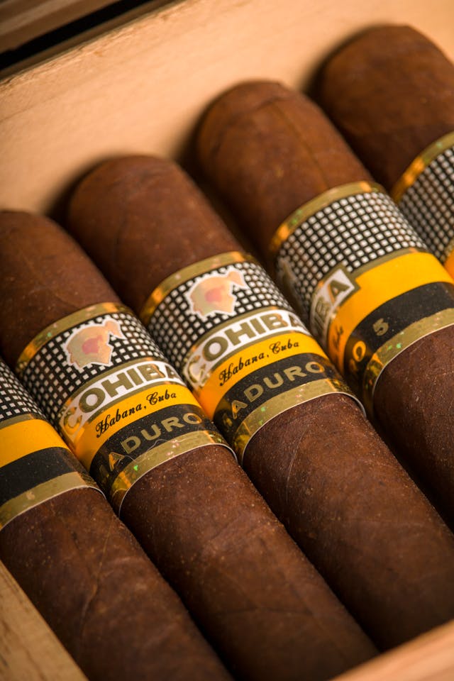 maduro cigars lying in a humidor