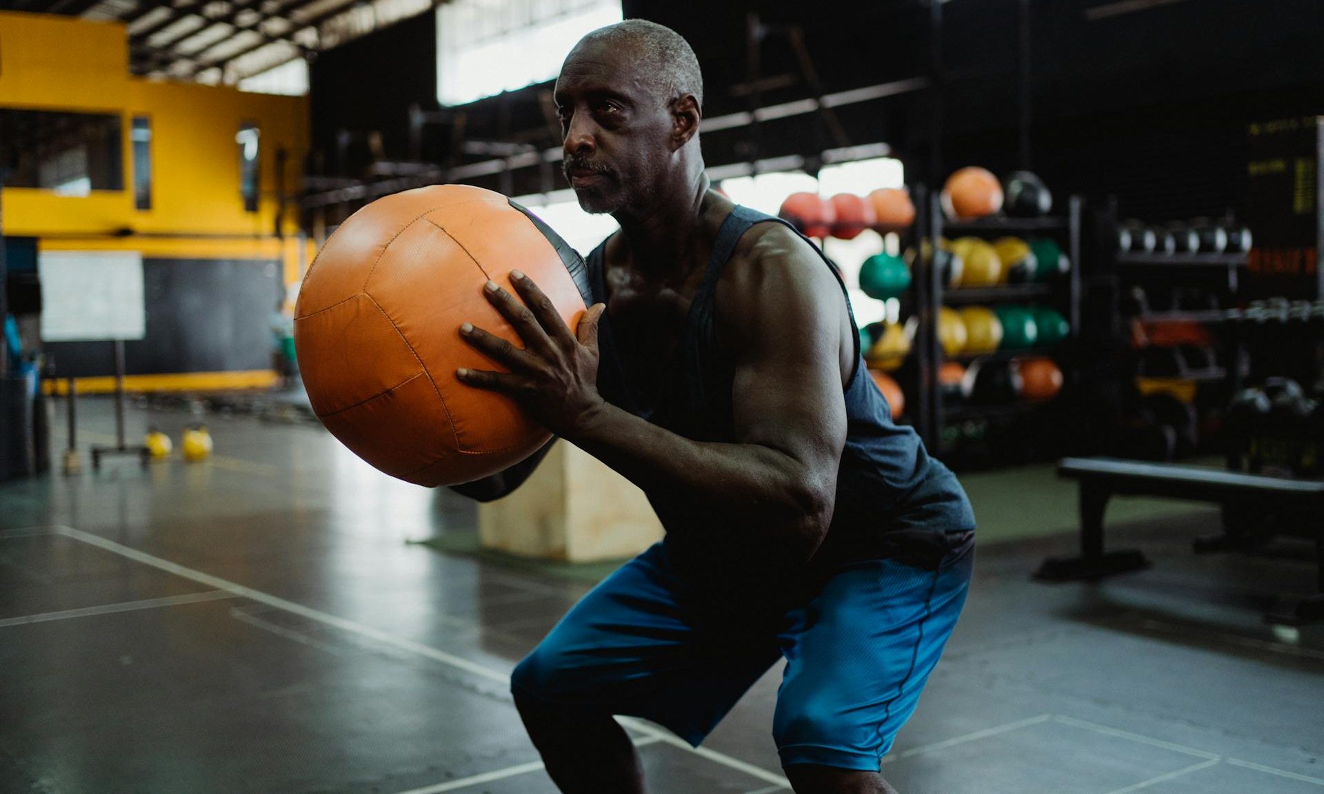 older man with exercise ball