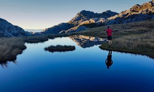 man standing by water outdoors