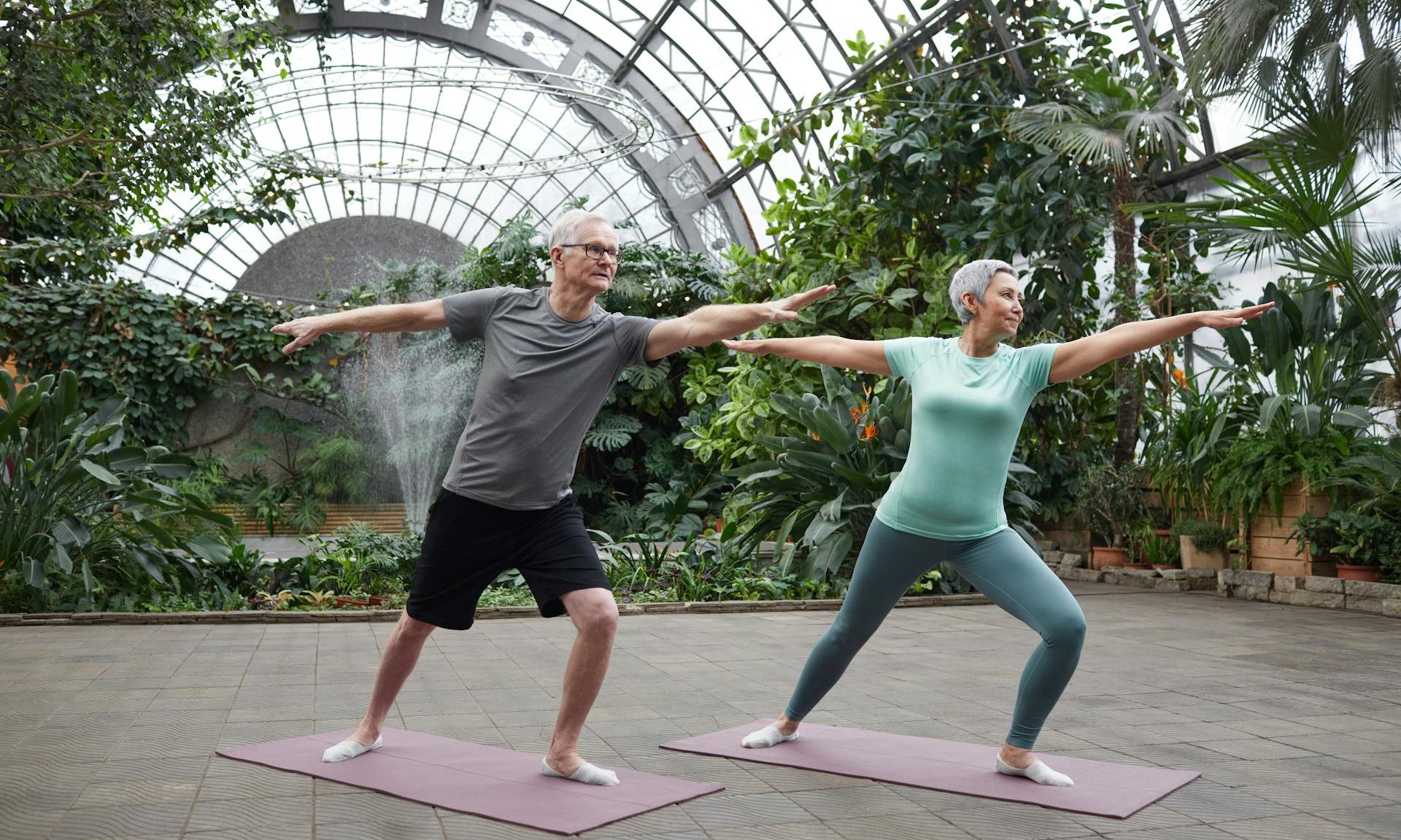 older couple doing yoga