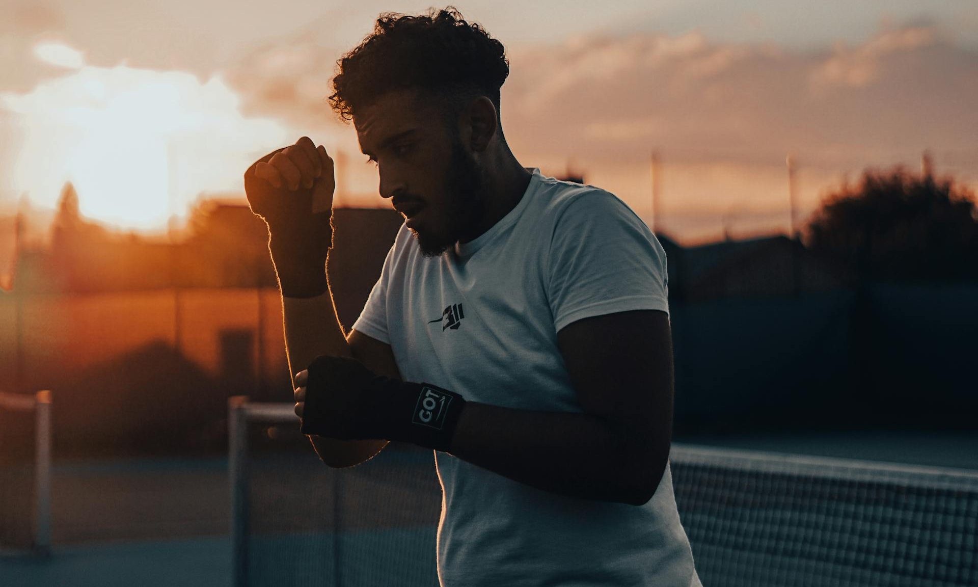 man exercising at sunset