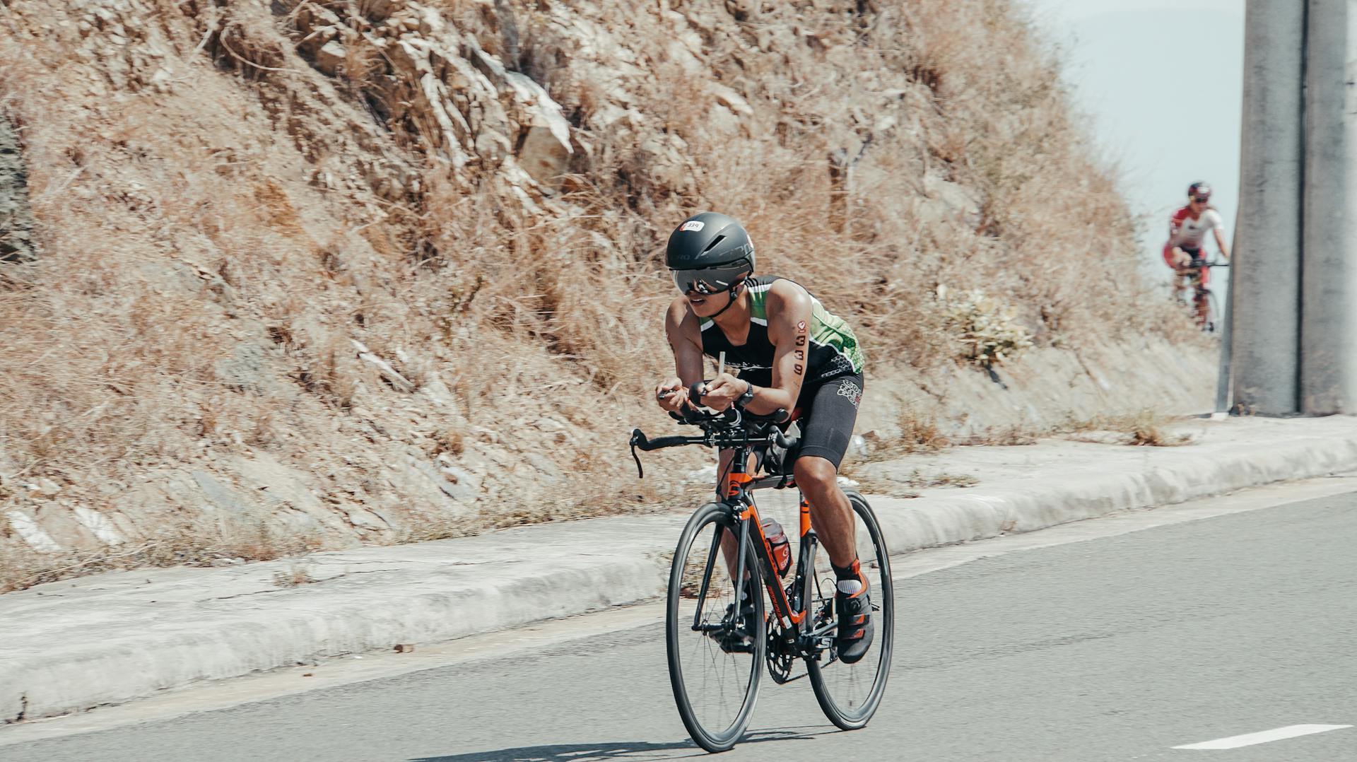 person cycling outdoors