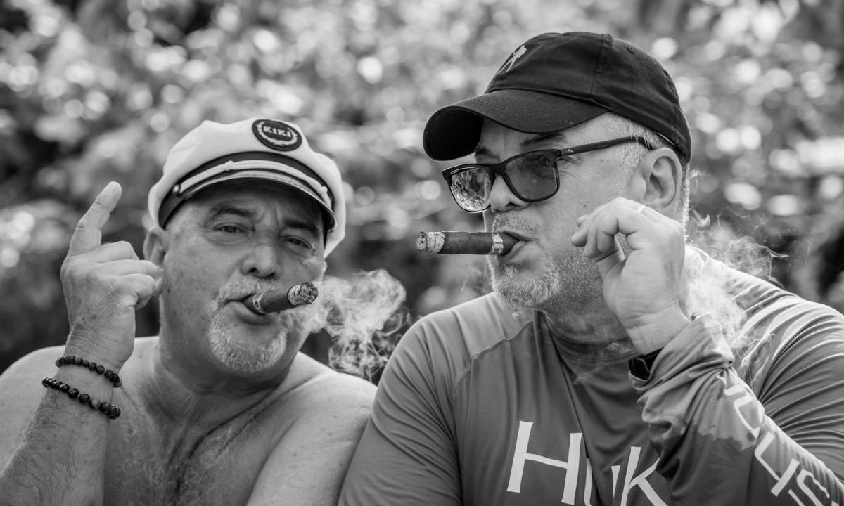 two men enjoying cigars