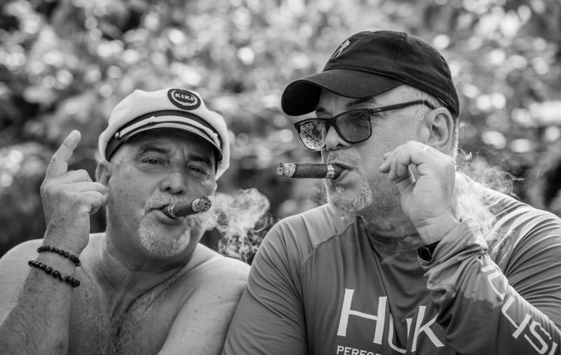 two men enjoying cigars