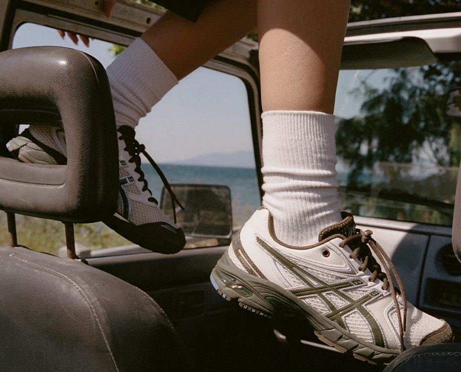 man wearing asics temptation vacation sneakers in car
