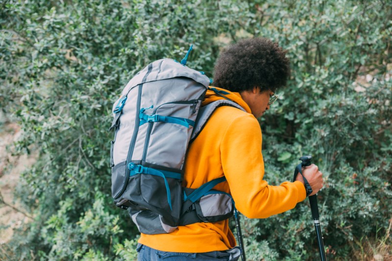 Man wearing rucking backpack.