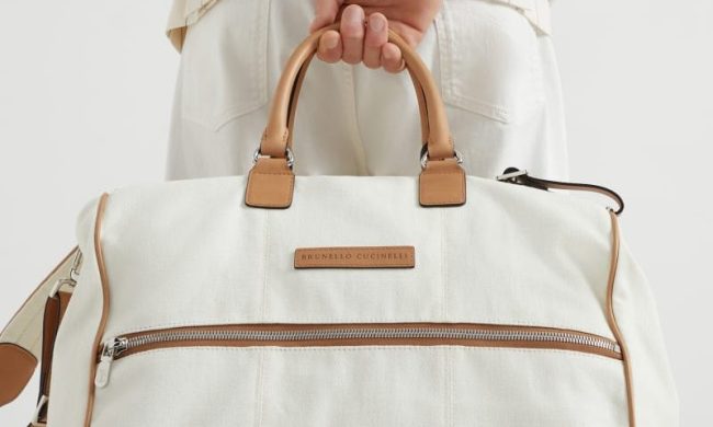 man holding travel bag
