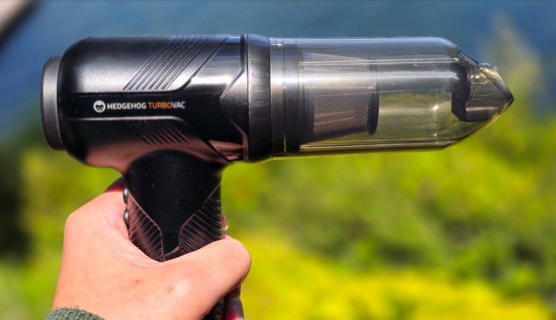 Side view of the Hedgehog TurboVac gripped by a hand