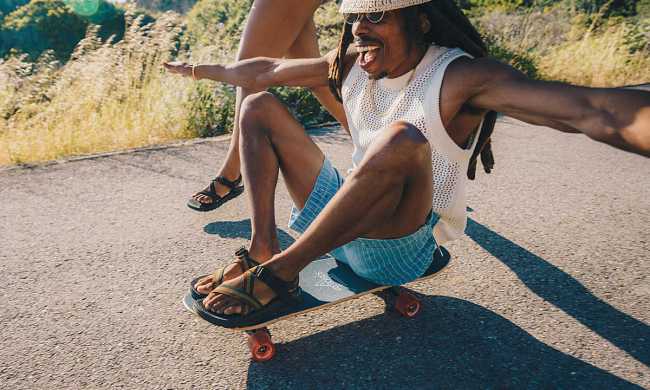 man on skateboard wearing chaco bob marley