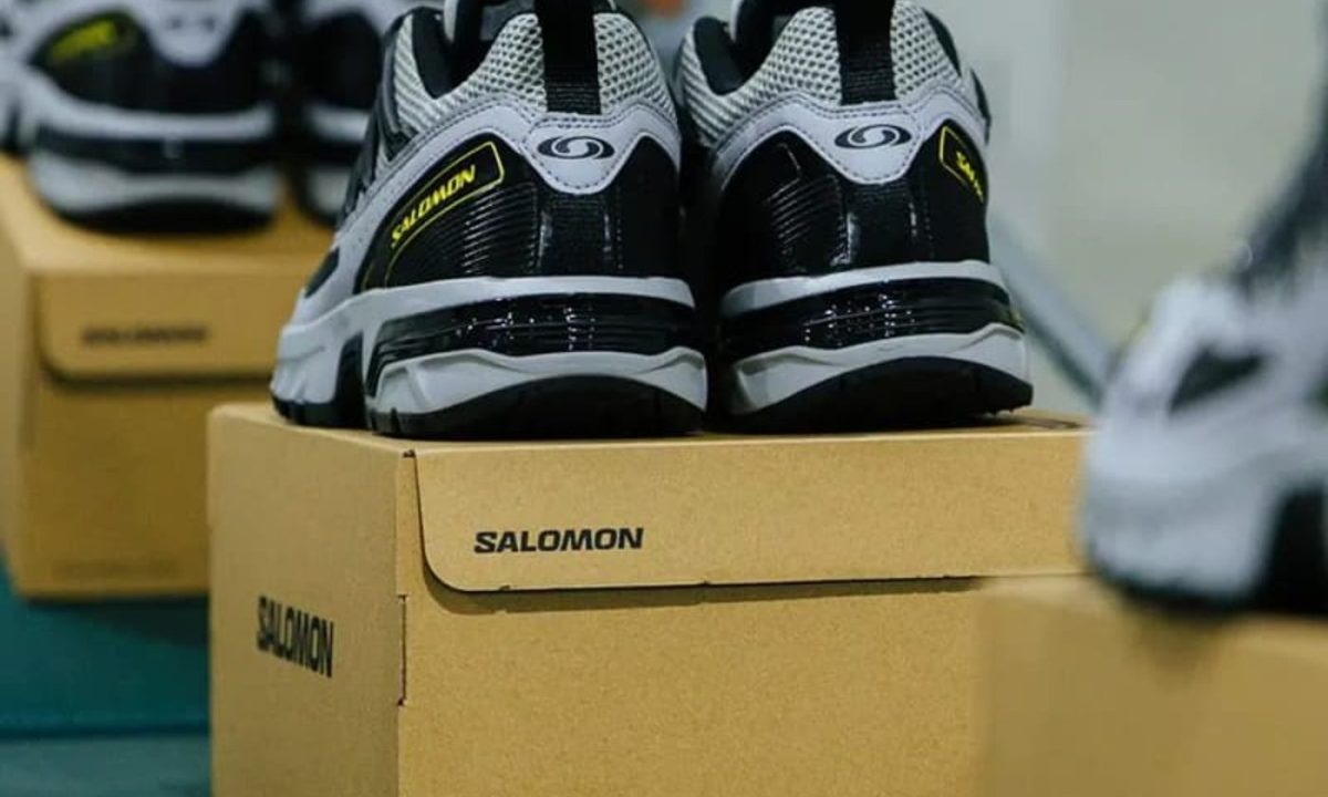 salomon sneaker on top of shoe box