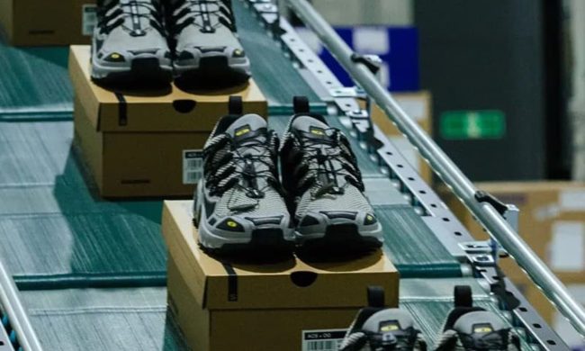 beams, salomon sneaker on assembly line