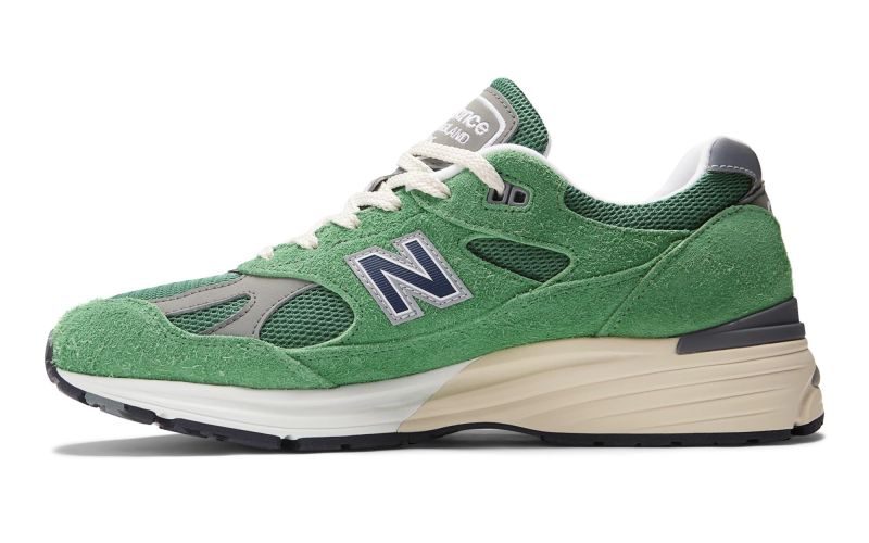 side view of new balance green sneaker