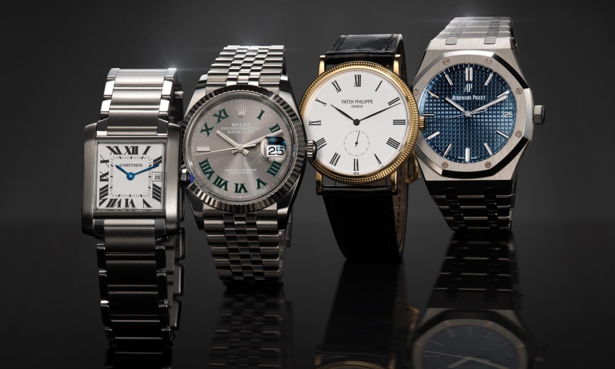 A row of four luxury watches.