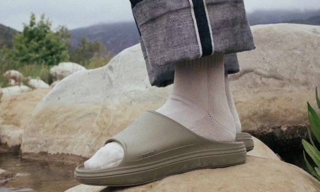 man wearing sage green sandals