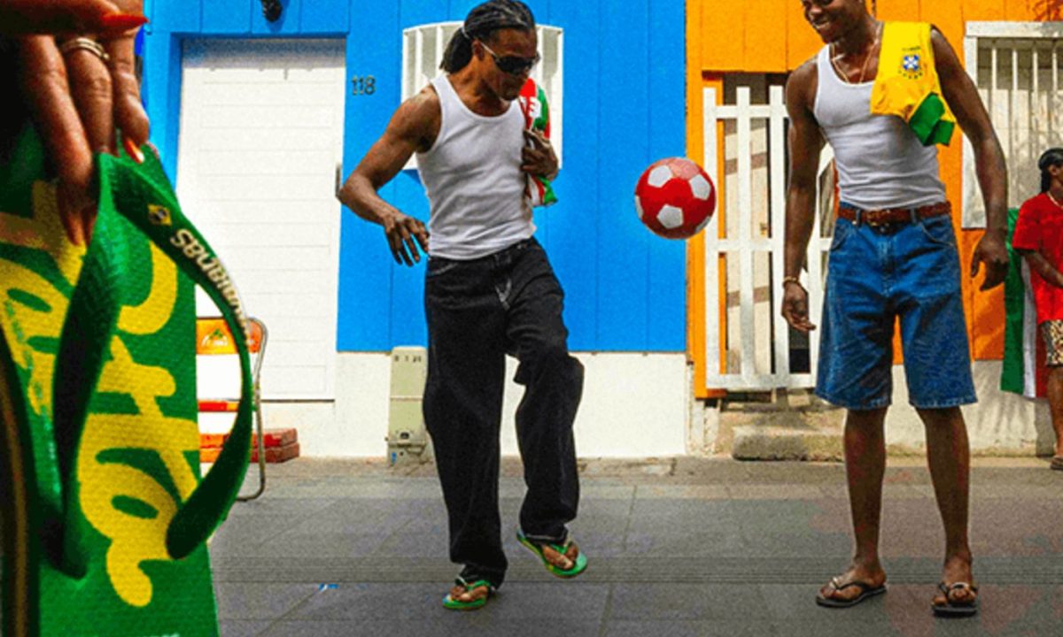 men playing soccer on the street with flip flops