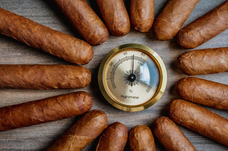 cigars circling a hygrometer