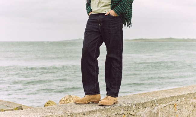 man on the beach wearing suede viberg shoe