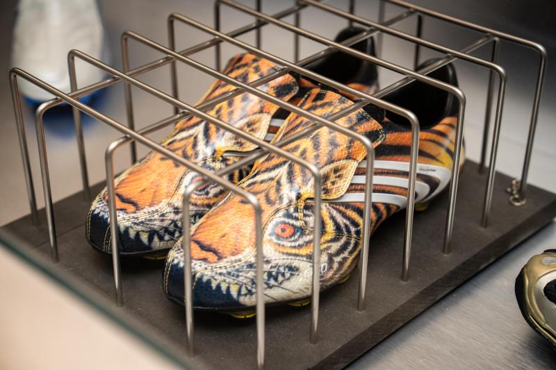 adidas sneakers in a cage