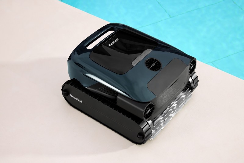 The Beatbot AquaSense 2 Pro robotic pool cleaner beside the swimming pool.
