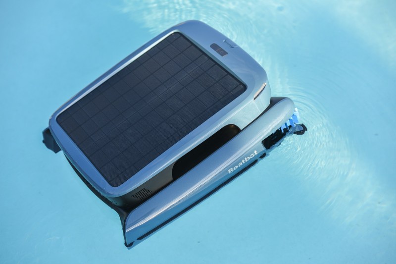 The Beatbot iSkim Ultra robotic pool cleaner in the swimming pool.