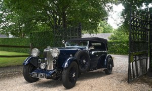F1 legend Bernie Ecclestone 1934 Lagonda left front three quarter view entering an estate