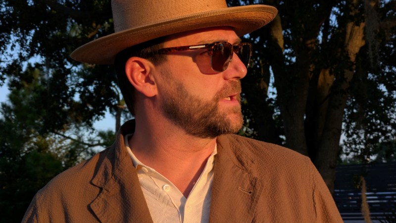 Man in Buck Mason Carry-On Suit and hat