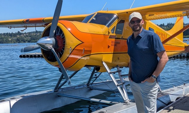Man in polo by a plane