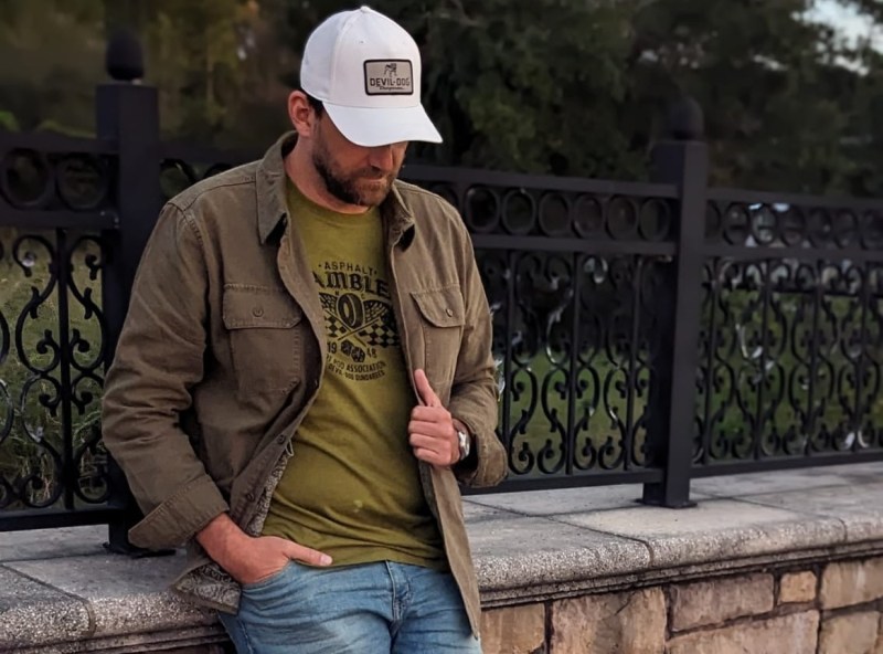 Man leaning on bridge