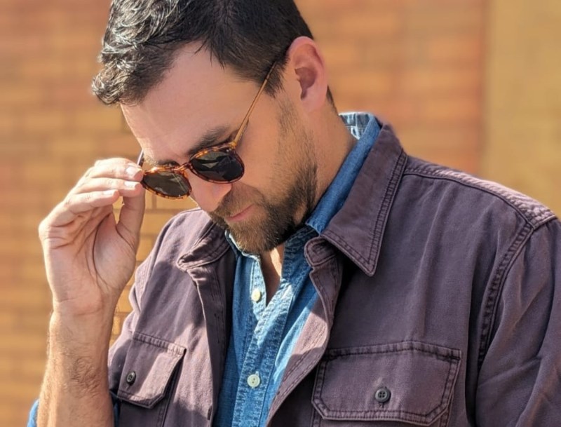 Man taking off his sunglasses