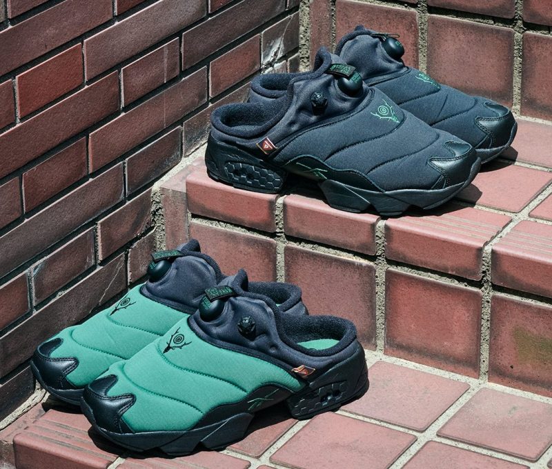 green and black reebok mules