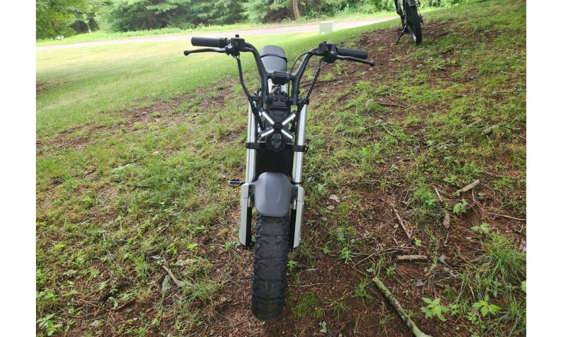 Segway Xyber e-bike direct frontal shot parked on a grassy hill.