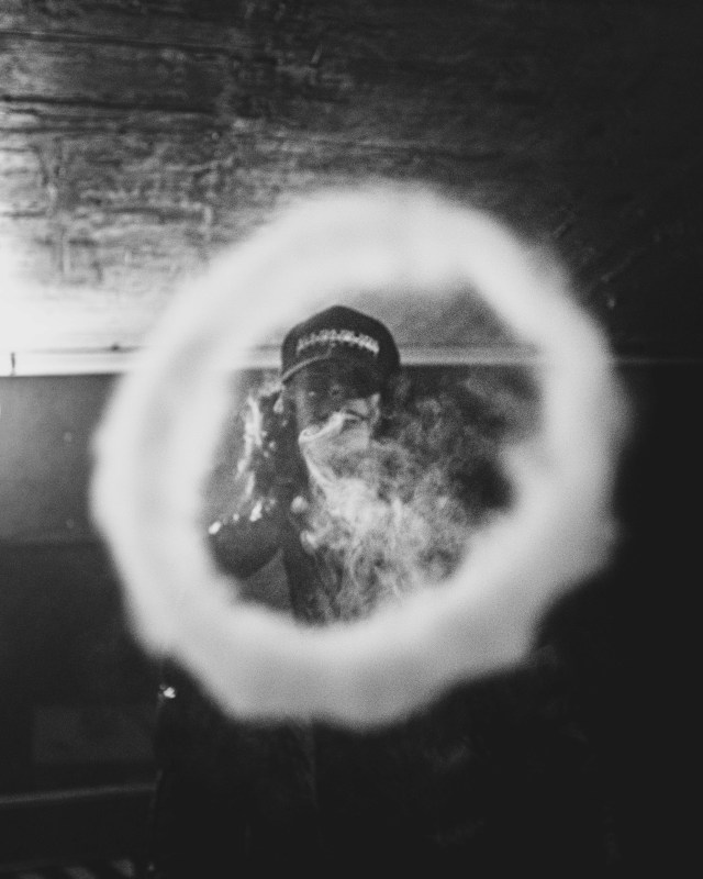 a person blows a smoke ring