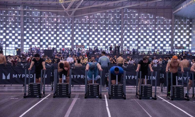 sled push indoors athletes HYROX