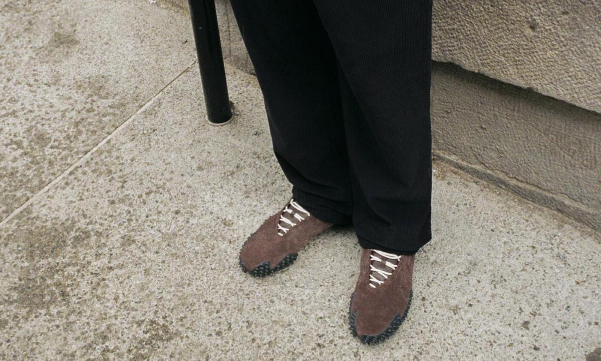 man wearing puma mostro sneaker jjjound