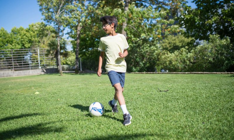 kid playing football
