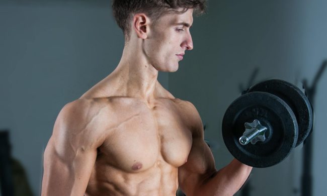 man doing bicep curl with dumbbell