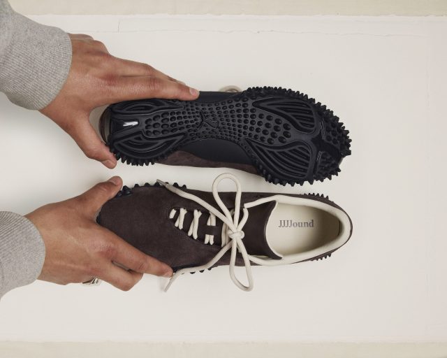person holding JJJJound x Puma sneaker