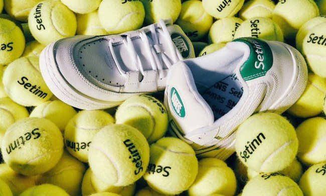 sneakers in a middle of tennis balls