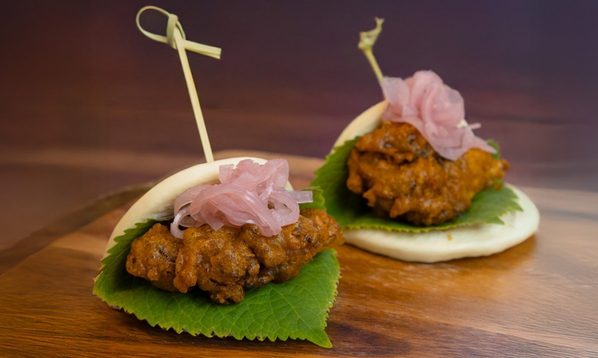 Crispy maitake mushroom and fried chicken bao topped with yuzu aioli