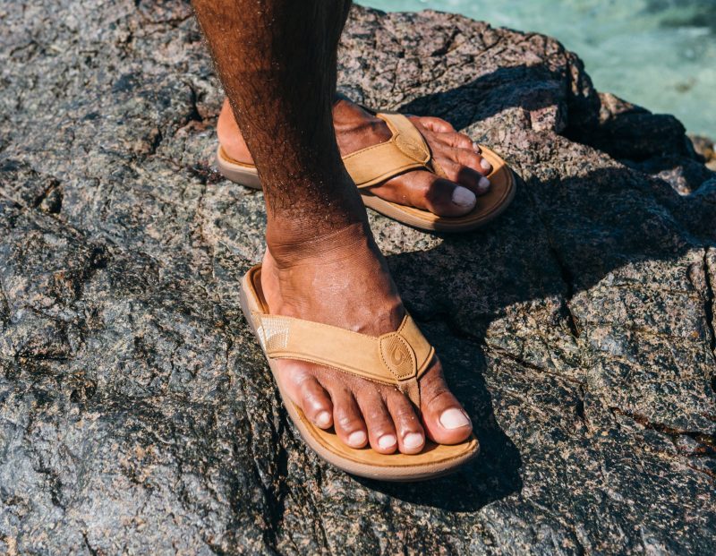 man wearing flip flops Olukai