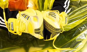 man wearing adidas adizero sneakers
