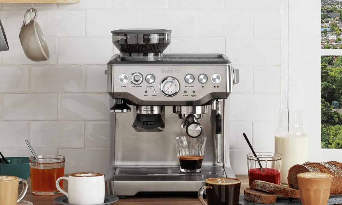 The Breville Barista Express espresso machine on a kitchen counter.