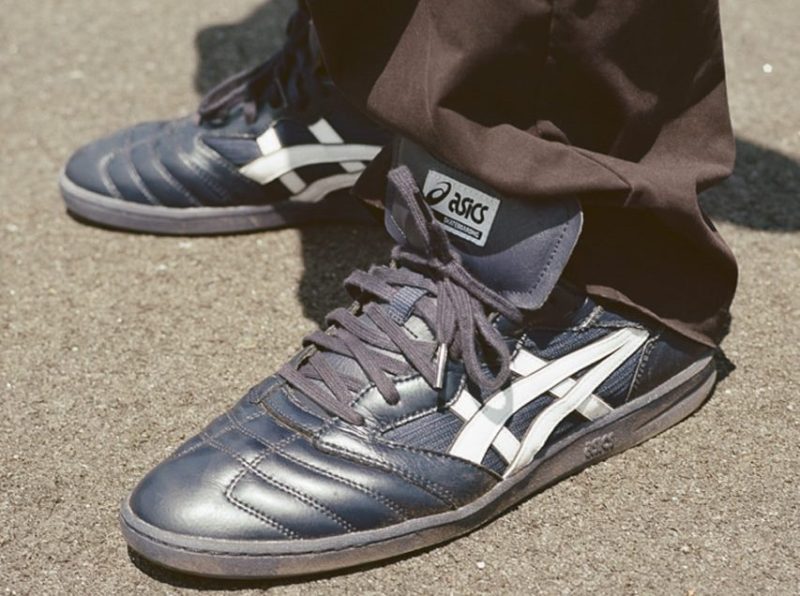 man wearing asics sneaker