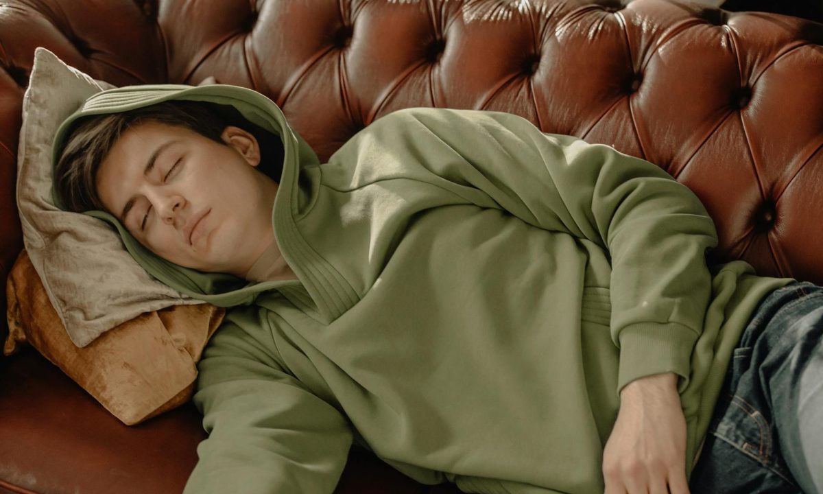 man sleeping on hoodie