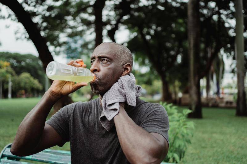 Man drinking electrolytes.