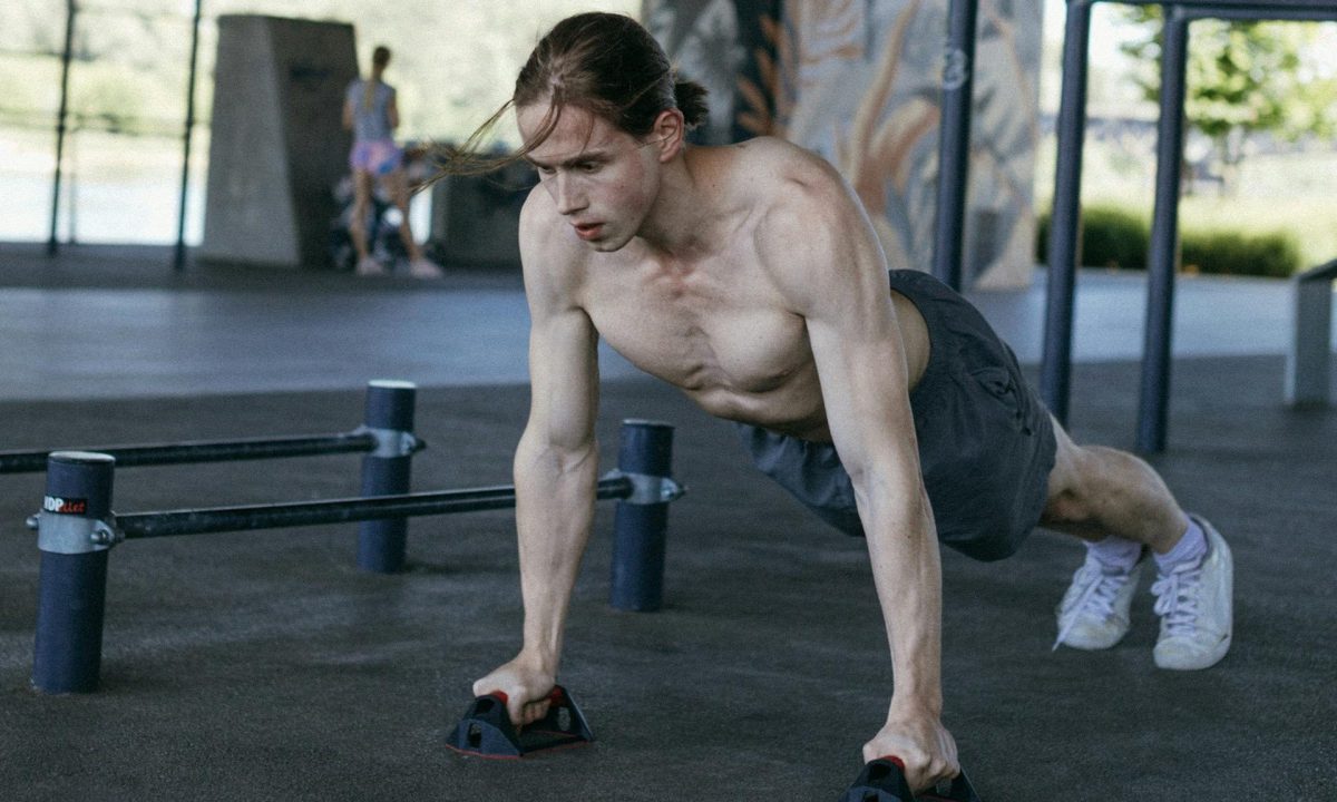 man exercising doing push up