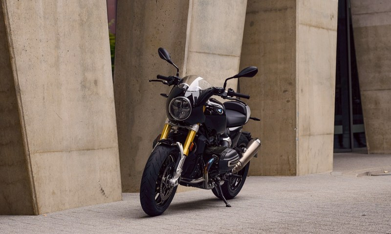 2026 BMW R 12 NineT with Tracker package parked on concrete next two a stone building.