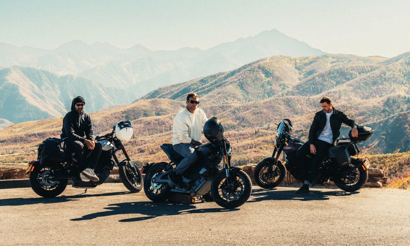 Three riders parked on the roadside with LiveWire S2 Alpinistas with mountains in the background.