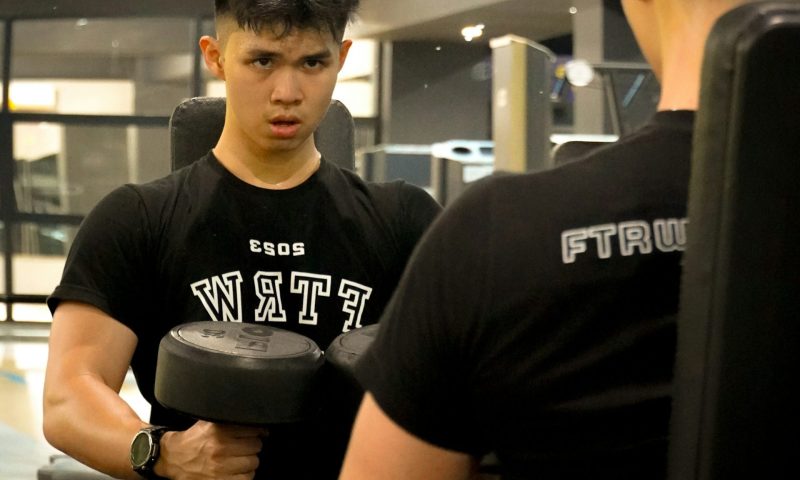 kids teen lifting weight dumbbell